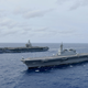 JS Izumo sailing alongside the aircraft carrier USS Ronald Reagan, June 2019.